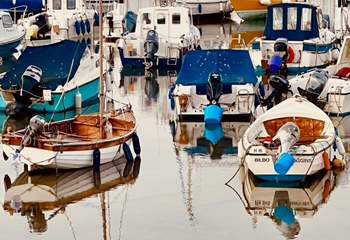 Colourful boats in the harbour at Lyme Regis.