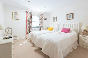 Bedroom 2 has twin beds and is light and airy.