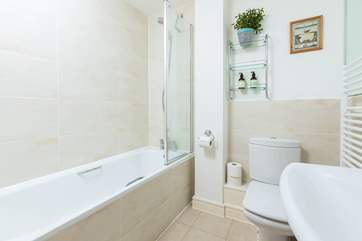 The family bathroom where you can take a quick shower or soak in the bath after a day of adventures.