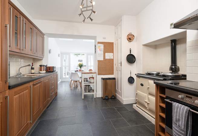 The kitchen/dining area is perfect for bringing the family together. Please note the Aga is ornamental only.