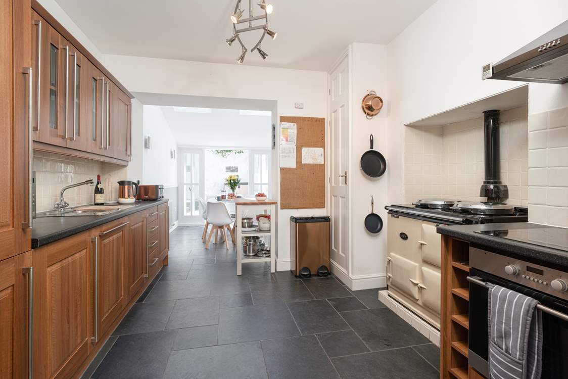 The kitchen/dining area is perfect for bringing the family together. Please note the Aga is ornamental only.