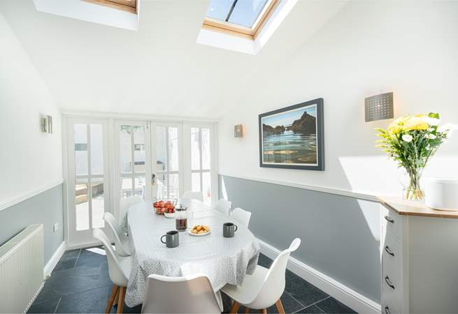 The dining-area leads out to the sunny courtyard and is flooded with light.