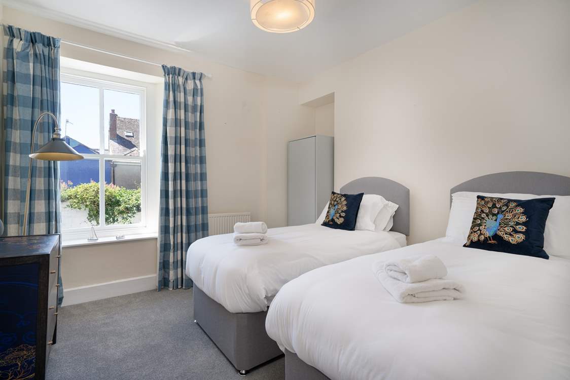 Bedroom one is a twin room with views over the courtyard on the first floor.