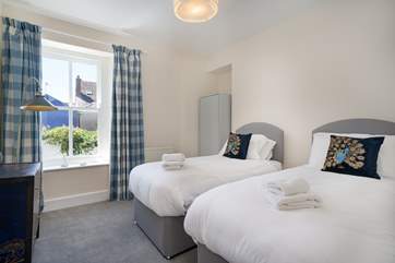 Bedroom one is a twin room with views over the courtyard on the first floor.