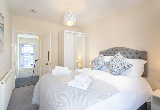 Bedroom three, at the top of the stairs on the second floor, has a comfortable double bed.