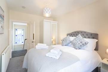 Bedroom three, at the top of the stairs on the second floor, has a comfortable double bed.