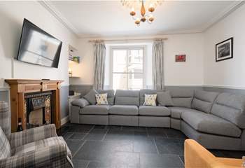 The cosy sitting-room is perfect for relaxing in after a full day at the beach.