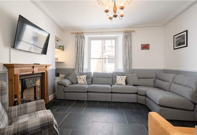 The cosy sitting-room is perfect for relaxing in after a full day at the beach.