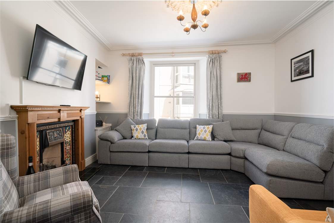 The cosy sitting-room is perfect for relaxing in after a full day at the beach.
