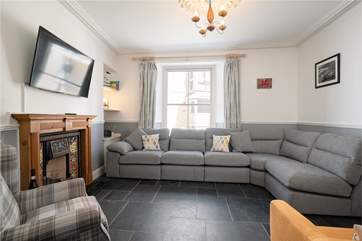 The cosy sitting-room is perfect for relaxing in after a full day at the beach.
