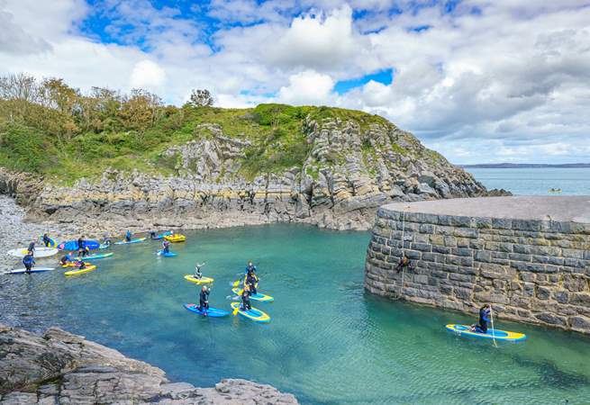 Make the sea a part of your holiday and try stand up paddle boarding at Stackpole Quay.
