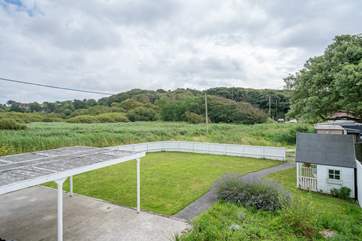 The rear windows to the apartment overlook countryside views.