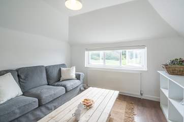 The snug sitting-area is ideal to cosy up in the evenings whilst watching the television.