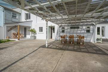 The lovely shaded patio area is spacious and offers plenty of seating.