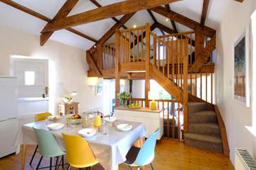 The kitchen is just above the sitting-room while the mezzanine looks over the kitchen.