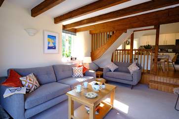 The living-room leads off from the kitchen and into the garden . Mind the steps between the rooms.