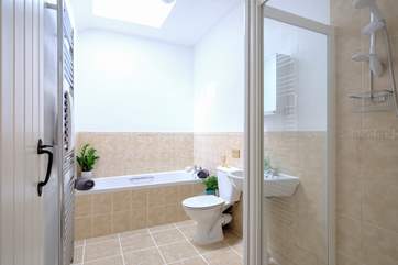 The main bathroom with a bath and separate shower.