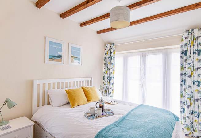 Bedroom one has French doors and looks out across the gravelled courtyard.