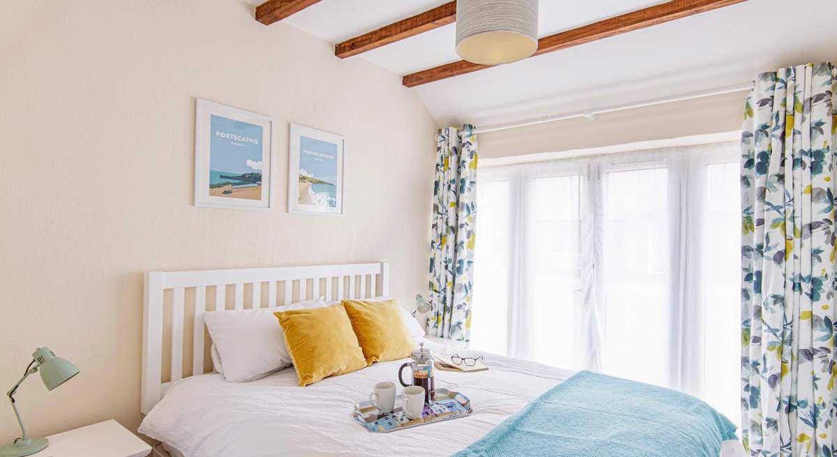 Bedroom one has French doors and looks out across the gravelled courtyard.