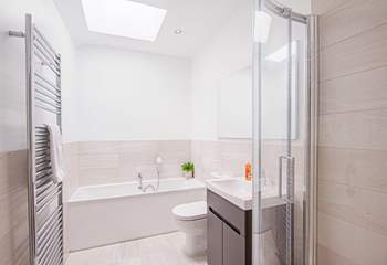 The family bathroom has a walk-in shower and bath.