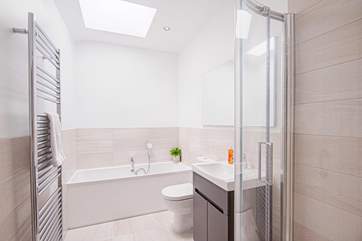 The family bathroom has a walk-in shower and bath.