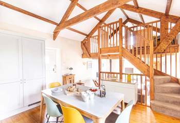 The kitchen is just above the sitting-room while the mezzanine looks over the kitchen.