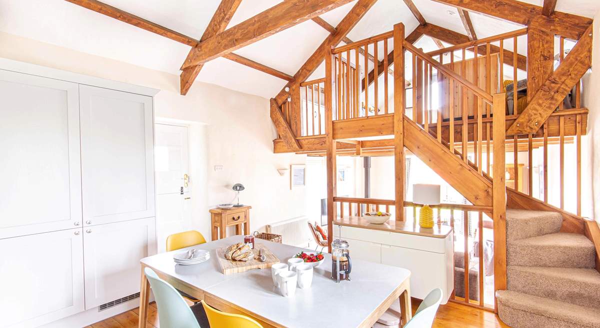 The kitchen is just above the sitting-room while the mezzanine looks over the kitchen.