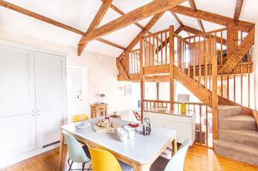 The kitchen is just above the sitting-room while the mezzanine looks over the kitchen.