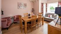 The separate dining-room has easy chairs for a quiet read with a good book.