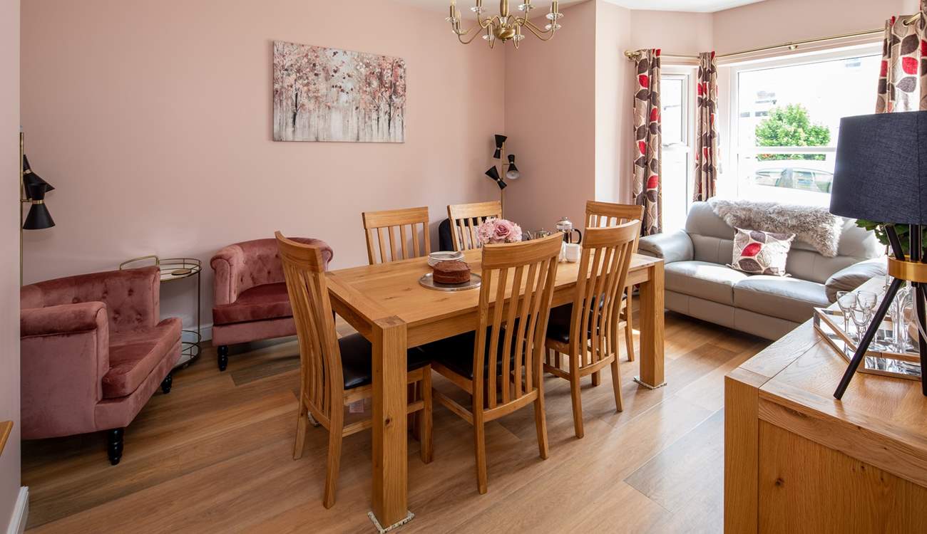 The separate dining-room has easy chairs for a quiet read with a good book.