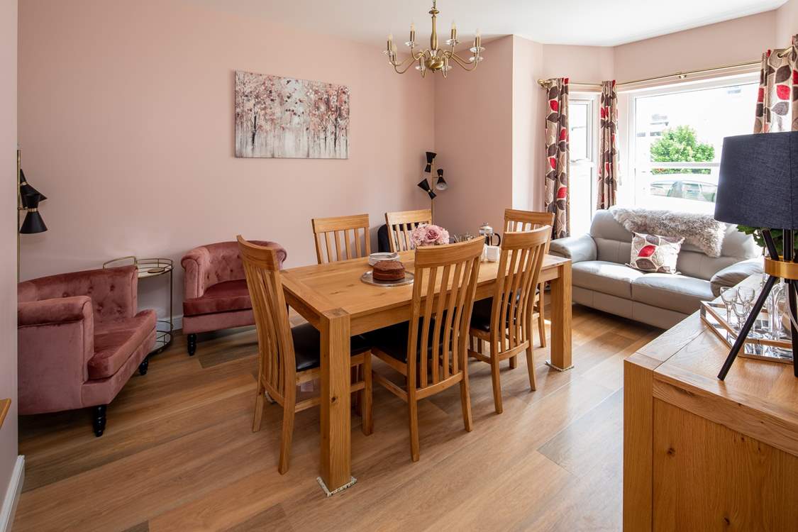 The separate dining-room has easy chairs for a quiet read with a good book.