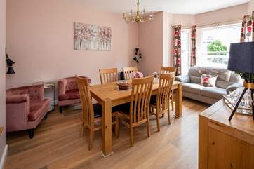 The separate dining-room has easy chairs for a quiet read with a good book.