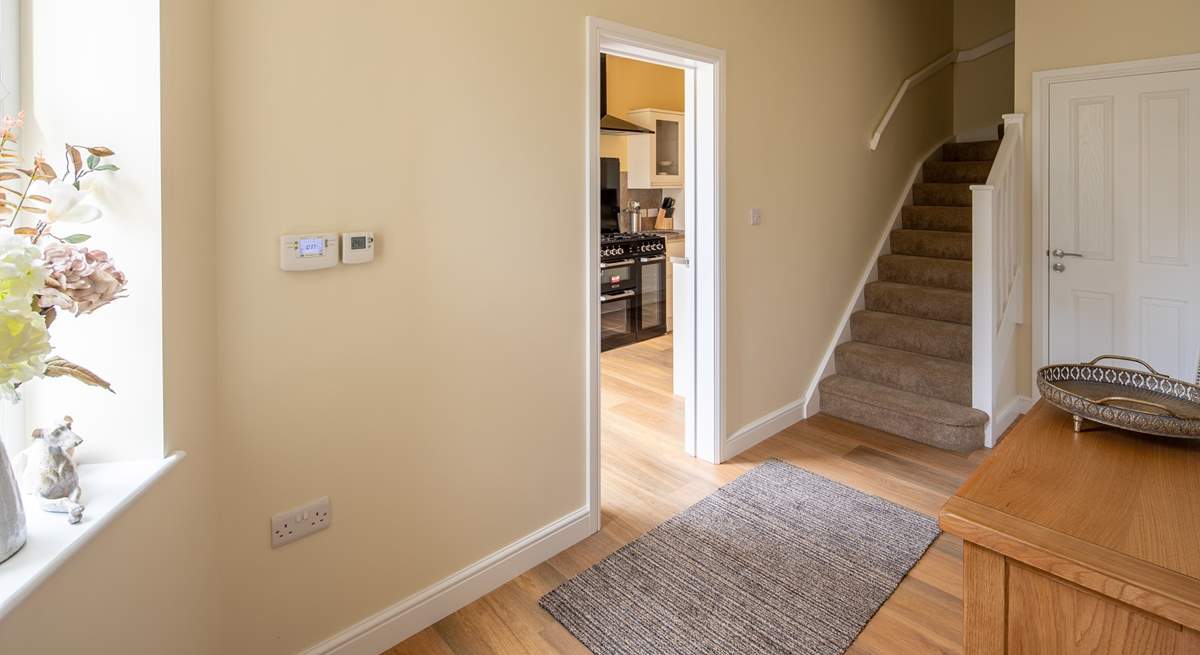 Staircase leads from the ground floor to the first floor sitting-room and bedrooms on the first and second floor.