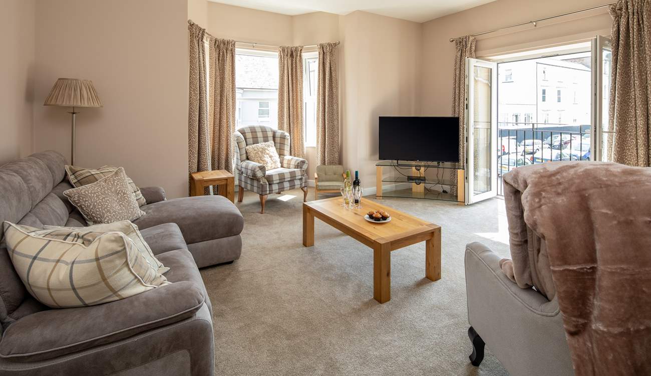 With patio doors opening onto the Juliet balcony, the first floor sitting-room is bright and airy.