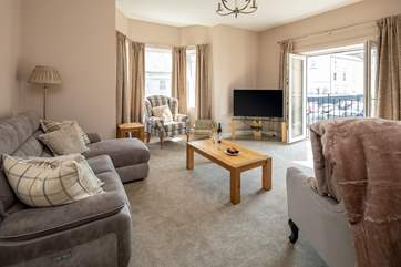 With patio doors opening onto the Juliet balcony, the first floor sitting-room is bright and airy.