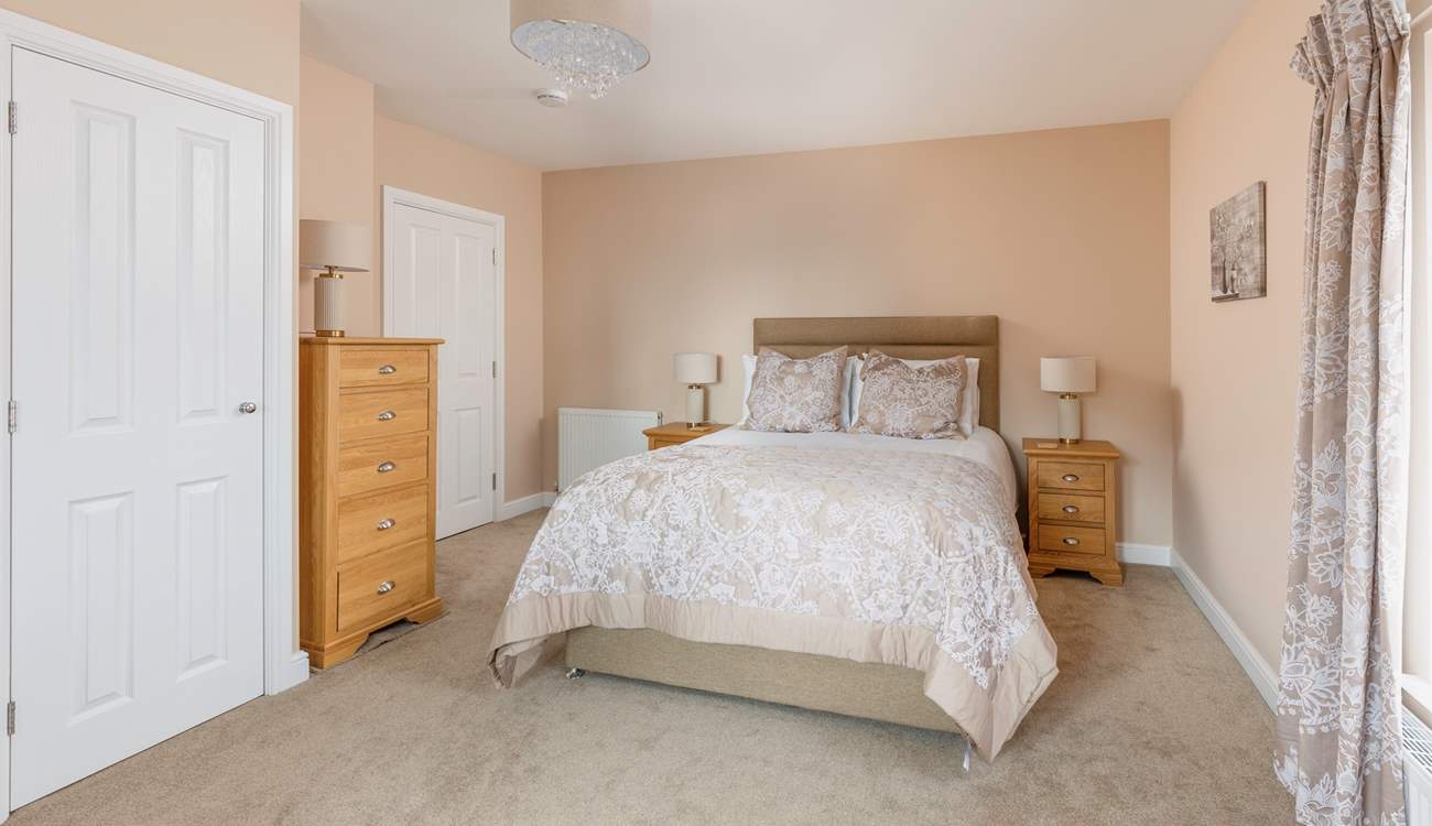 Bedroom 2 is a pretty, spacious king room.