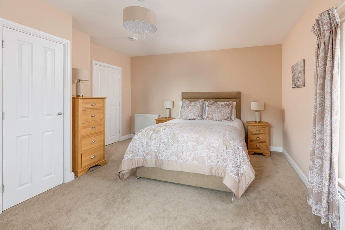 Bedroom 2 is a pretty, spacious king room.