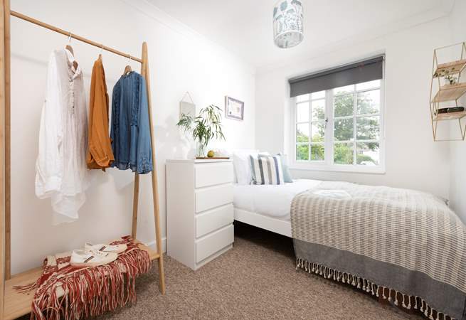 Bedroom 2 has a single bed and is prettily furnished.