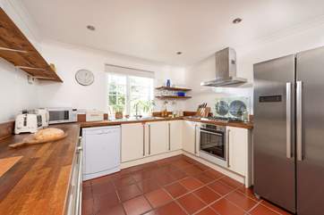 The kitchen is well-equipped with a spacious double fridge/freezer to keep all your holiday supplies fresh.