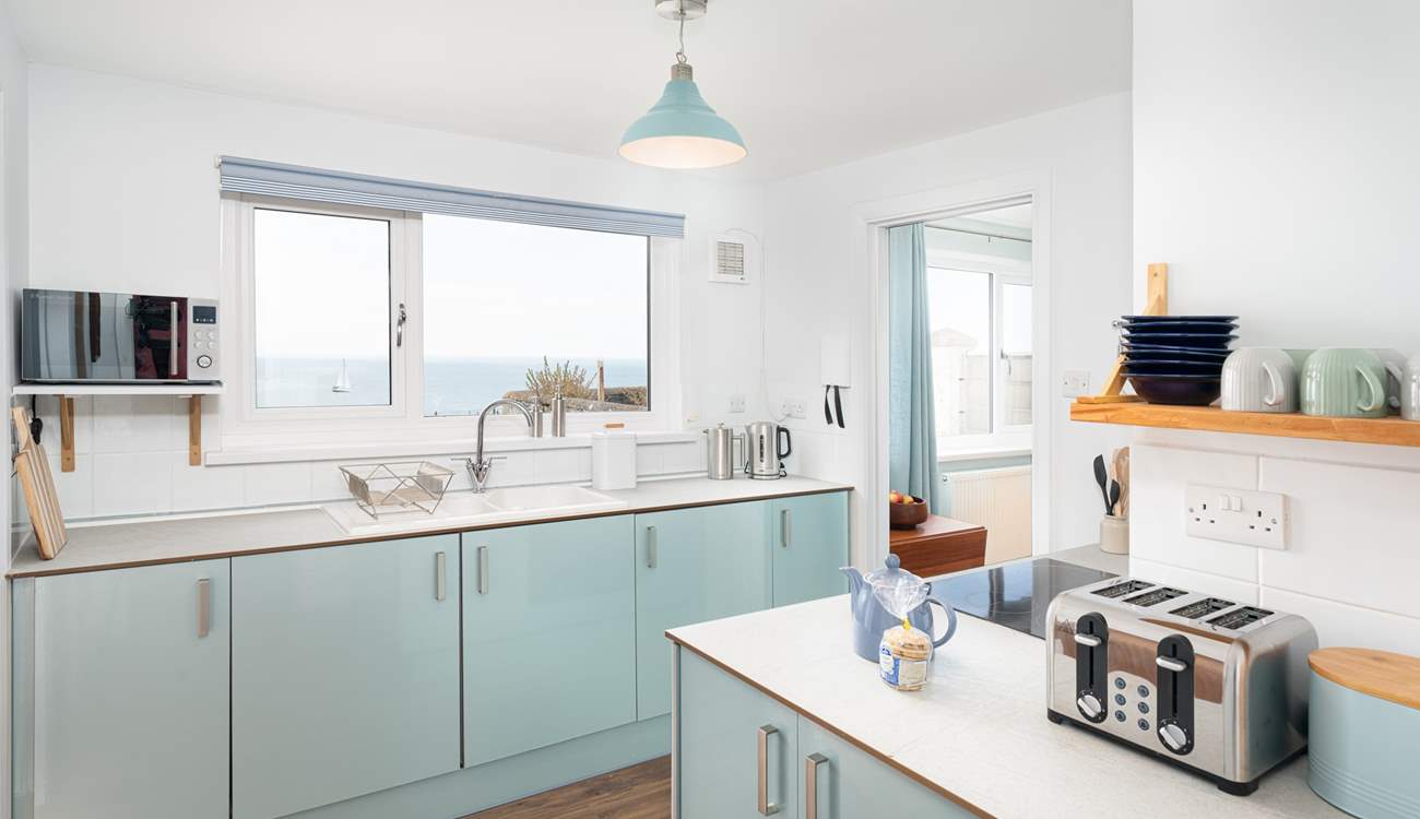 The gorgeous kitchen in cool, calming tones, perfect for a house by the sea!