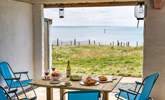 A sheltered space for dining al fresco and soaking up the views. - Thumbnail Image