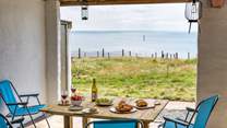 A sheltered space for dining al fresco and soaking up the views.