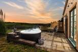 What a magical spot, sink back and relax in the cute hot tub for two. 