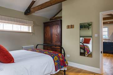 The bedroom is just off the kitchen area.