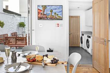 The dining-room leads off to the courtyard, utility and cloakroom.