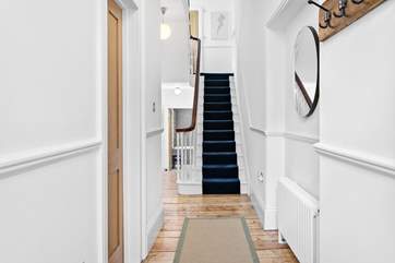 The hallway leading to the sitting-room on the ground floor.
