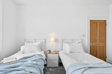Lovely linens and comfy beds in bedroom 3.