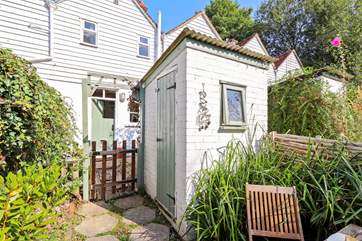 The utility-room which houses a washing machine and additional freezer.