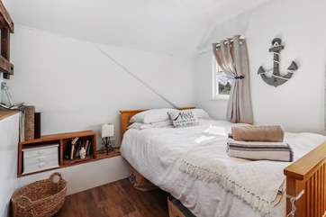 The smaller double room with countryside views of the back garden.