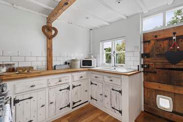 The kitchen has a stable-door leading to the back garden.